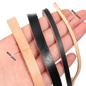 Handcrafted flat cowhide leather strips in black and tan with spliced joint details