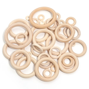 Various sizes of natural wood rings with polished finish for DIY jewelry and crafts