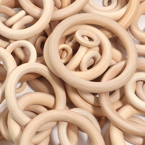 Macro shot of assorted natural wooden rings showing organic grain for DIY crafts