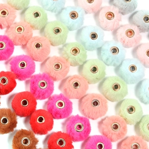 Close-up of colorful faux rabbit fur beads with rose gold metal large hole cores for DIY