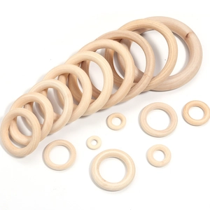 Various sizes of polished natural wooden rings for DIY craft and bag accessories