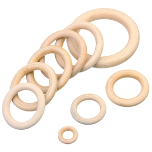 Natural wood rings in various sizes for DIY crafts and accessories on white background