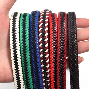 Hand holding various two-tone braided PU leather cords for DIY bracelet jewelry making