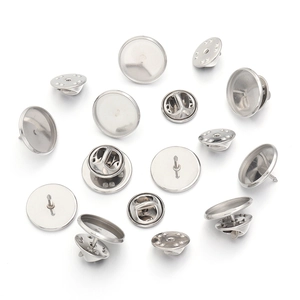 Detailed macro view of silver stainless steel round base pins and butterfly clutch backings