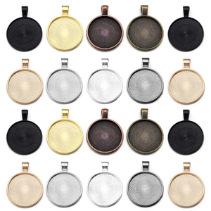 Flat lay of 20 assorted colorful zinc alloy round pendant trays for DIY jewelry making