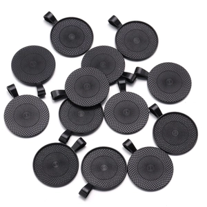 Macro detail of round alloy tray pendants with vintage mesh texture for DIY jewelry