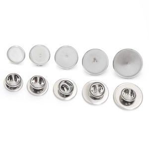 Macro view of five sizes of round stainless steel cufflinks blanks and butterfly backings