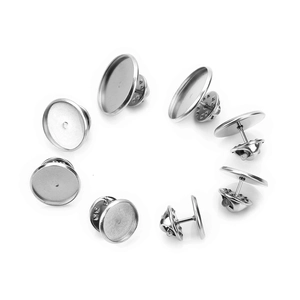 Detailed view of silver stainless steel round lapel pin blanks and butterfly clutch backs