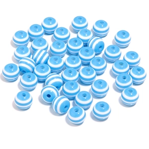 Detailed close-up of 20mm blue and white striped resin candy beads for DIY jewelry making