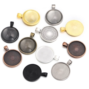 Assorted vintage alloy round pendant trays with textured patterns for DIY jewelry making