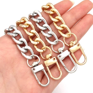 Detailed close-up of durable metal NK chains with swivel lobster clasps in gold and silver