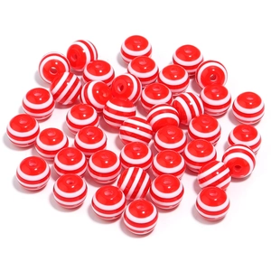 Detailed view of 20mm red and white striped resin beads with smooth surface for DIY jewelry