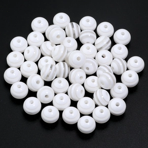 Macro view of 20mm white candy colored resin barrel beads with striped texture for DIY jewelry