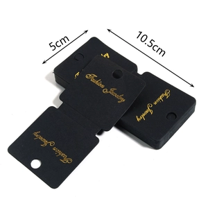 Macro shot of 10.5x5cm black jewelry display card with gold Fashion Jewelry foil