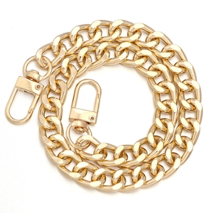 Polished gold curb chain strap for bags with dual swivel lobster clasps on white background