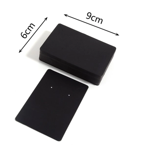 Detail view of 9cm x 6cm black thick cardboard jewelry display card with pre-cut holes