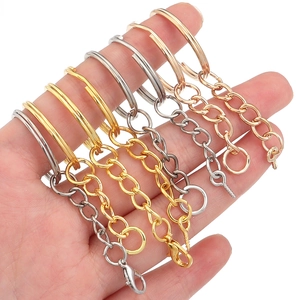 Detail of assorted metal split keychains with links and screw eyes in various finishes