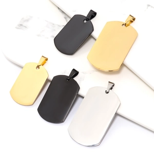 Detailed view of blank military dog tag pendants in gold, black, and silver for DIY jewelry