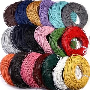 Detailed flat lay of colorful round leather cords for DIY jewelry making and crafts