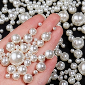 Mix of multiple sizes of high-gloss white ABS faux pearls for DIY jewelry making