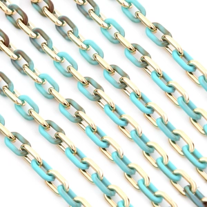 Macro view of gold metal and turquoise marble acrylic chain links for DIY jewelry making