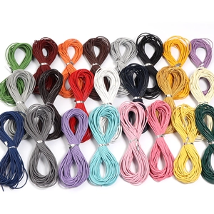 Macro shot of assorted colorful round genuine leather cords for DIY jewelry making crafts