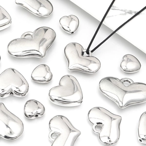 Polished silver heart-shaped metal beads in various sizes for DIY jewelry making