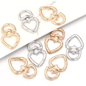 Detail of heart-shaped zinc alloy lobster clasps in gold, rose gold and silver finishes