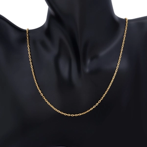 Close-up of golden O-chain necklace on black bust, minimalist flat cross links detail