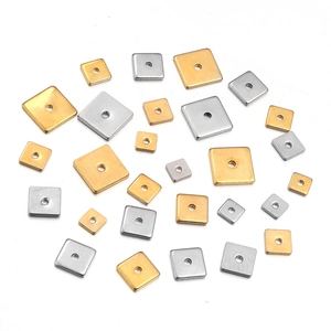 Close-up of square gold and silver stainless steel spacer beads for DIY jewelry making