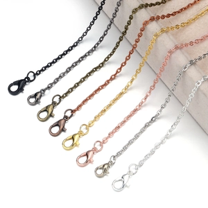 Detailed display of flattening cross chains in eight metallic finishes with lobster clasps