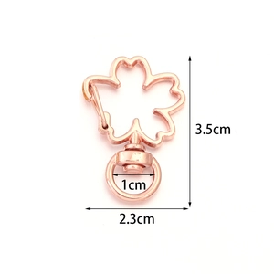 Detailed view of rose gold cherry blossom clasp with 3.5cm x 2.3cm size measurements