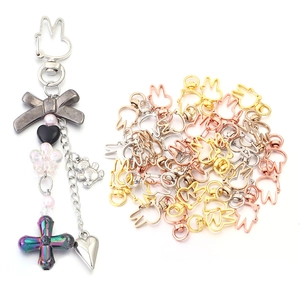 Detailed macro view of assorted rabbit-shaped zinc alloy lobster clasps for DIY jewelry