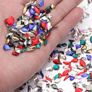 Close-up of colorful geometric glass rhinestones for nail art and DIY jewelry crafts