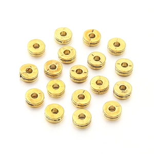 Platte gouden vintage afstandhouders met middengat en zwarte groeven voor sieraden