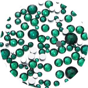 Close-up of emerald green flatback rhinestones with multi-faceted cut for nail art DIY