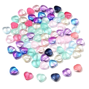 Close-up of assorted heart-shaped colorful glass beads for DIY jewelry making