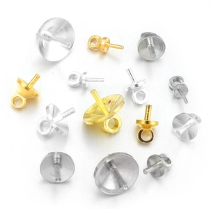 Detailed view of assorted copper pearl cup pegs in gold and silver for jewelry making