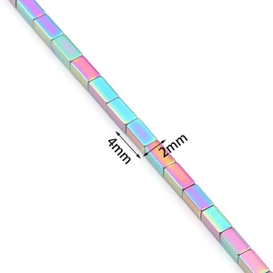 Macro shot of rainbow iridescent hematite 4x2mm rectangular beads for jewelry making