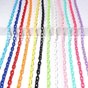 Close-up of multicolored acrylic chain links in twelve bright colors for DIY accessories