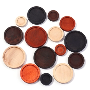 Assorted round wooden trays for DIY jewelry in four natural wood finishes and sizes