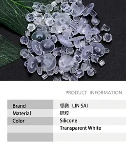 Close-up of clear silicone earring backs in plum and cylindrical shapes with metal cores