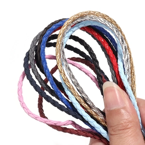 Macro detail of 3mm four-strand braided PU leather cords in vibrant metallic colors