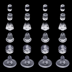 Macro display of diverse clear silicone earring backs and flower shaped stoppers