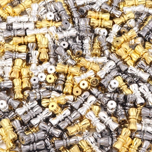 Detailed view of 11mm hourglass-shaped brass jewelry connectors for DIY bracelets
