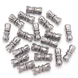 Close-up of 11mm silver brass peanut spiral clasps with detailed radial engraving