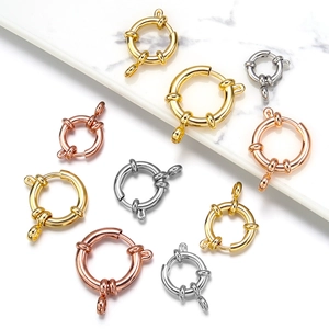 Détail de fermoirs à ressort ronds en or argent et or rose pour la création de bijoux