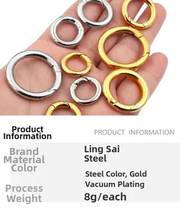 Polished gold and steel spring ring clasps for jewelry making held in hand for scale
