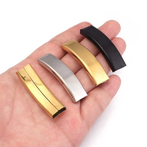 Macro detail of stainless steel curved tube clasps in gold silver and black for DIY jewelry