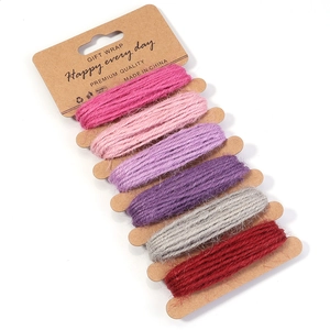 Detail of 6-color 2mm braided jute twine rolls on kraft cards for DIY gift wrapping